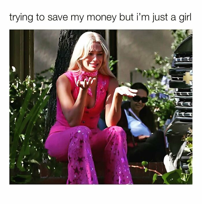 Young woman in pink outfit making a confused gesture, reflecting cute and wholesome posts for girlies online.