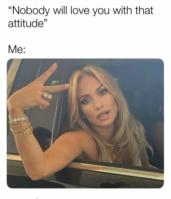 Woman leaning out of car window showing confident hand gesture, representing cute and wholesome posts for girlies online.