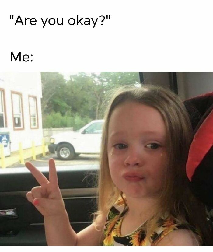 Young girl with tears making a peace sign inside a car, a cute and wholesome post shared by a dedicated page for girlies.