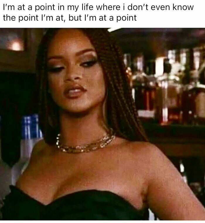 Woman in a bar setting with braided hair and necklace, expressing a relatable moment from cute and wholesome posts for girlies.