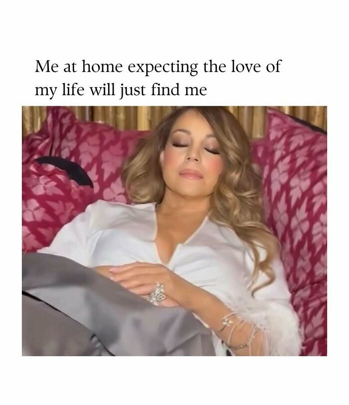 Woman resting peacefully on a patterned couch, representing cute and wholesome posts shared by a dedicated page for girlies.