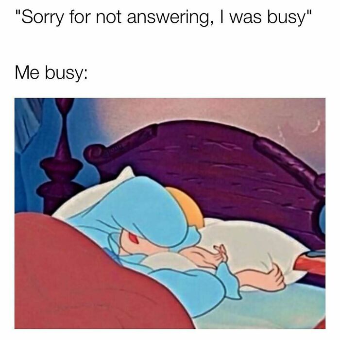 Person in blue pajamas lying in bed with face covered, humorously illustrating being too busy to answer messages.