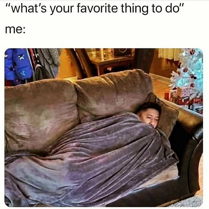 Person wrapped in a blanket on a couch, illustrating a cute and wholesome moment shared by a dedicated page for girlies.