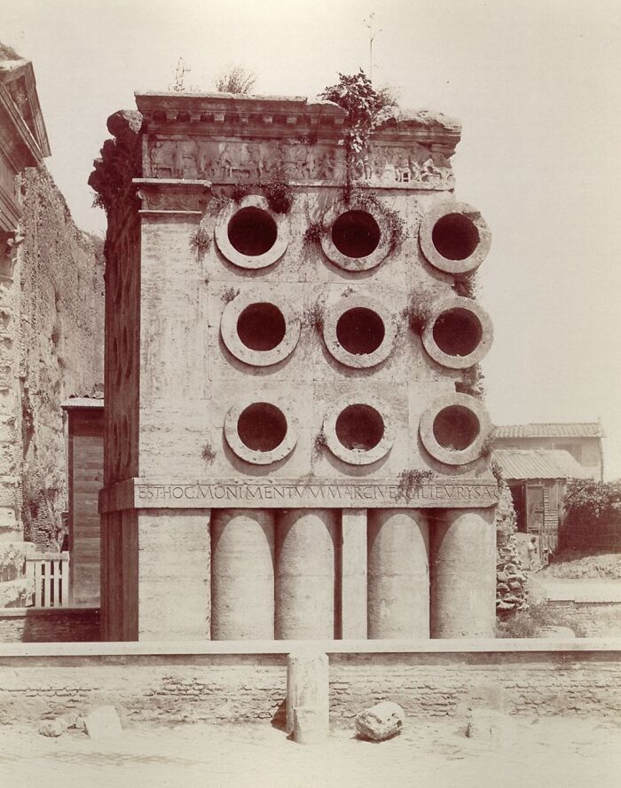 Ancient architectural structure with circular openings and classical design showcasing humanity's creativity in architecture.