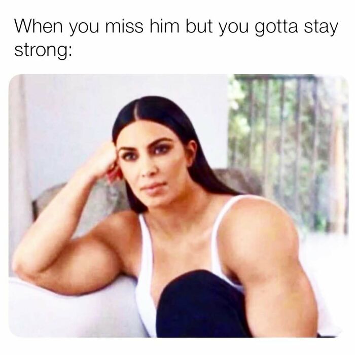 Woman with exaggerated muscular arms sitting with a strong expression, representing strength in cute and wholesome posts.
