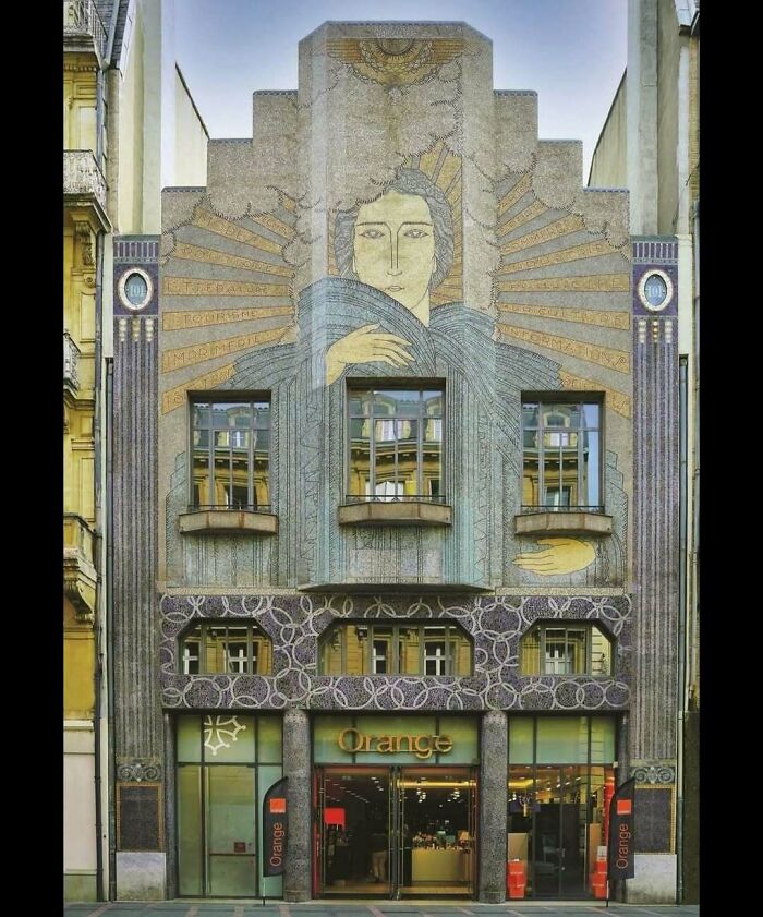 Art Nouveau building facade with mosaic mural showcases creativity in amazing architectural structures and design.
