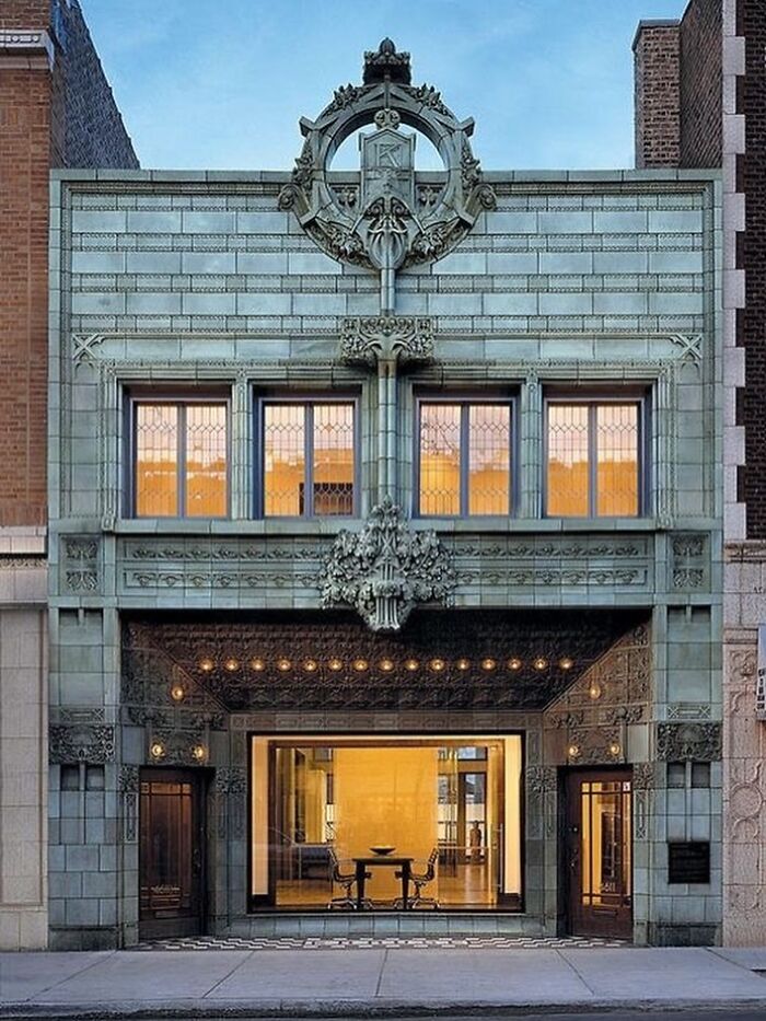 Facade of an amazing architectural structure with intricate design and large windows showcasing creativity in architecture.