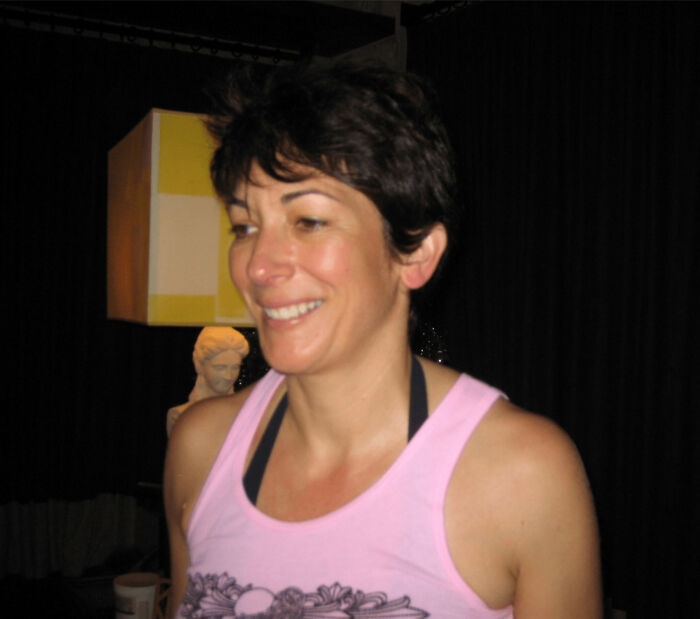 Woman in a pink tank top smiling indoors, related to former inmate revealing foul details about Ghislaine Maxwell in prison. Woman in a pink tank top smiling indoors, related to former inmate revealing foul details about Ghislaine Maxwell in prison.