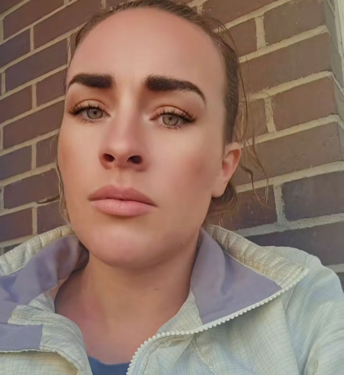 Close-up of a woman with serious expression, highlighting the story of four missing kids returned after doomsday abduction.