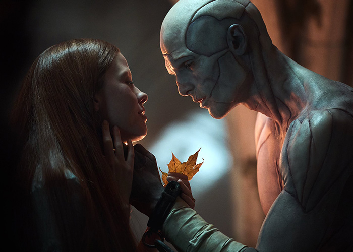 Close-up of two characters in an intimate moment from Oscar nominated movies 2026, featuring detailed makeup and emotional expression.