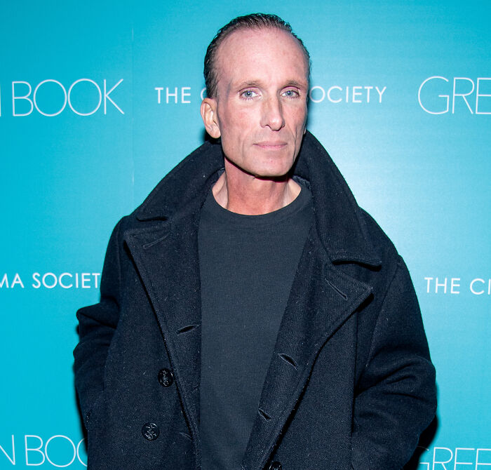 Peter Greene wearing a black coat at a film event, with fans stunned and confused by his cause of passing.