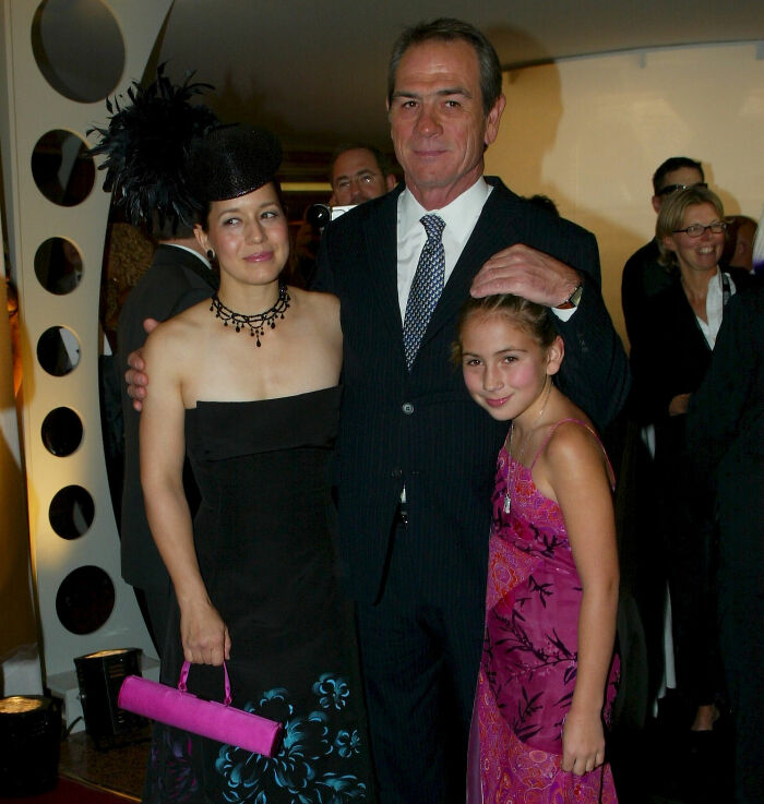 Tommy Lee Jones with his daughter and another woman at a formal event dressed in elegant attire.