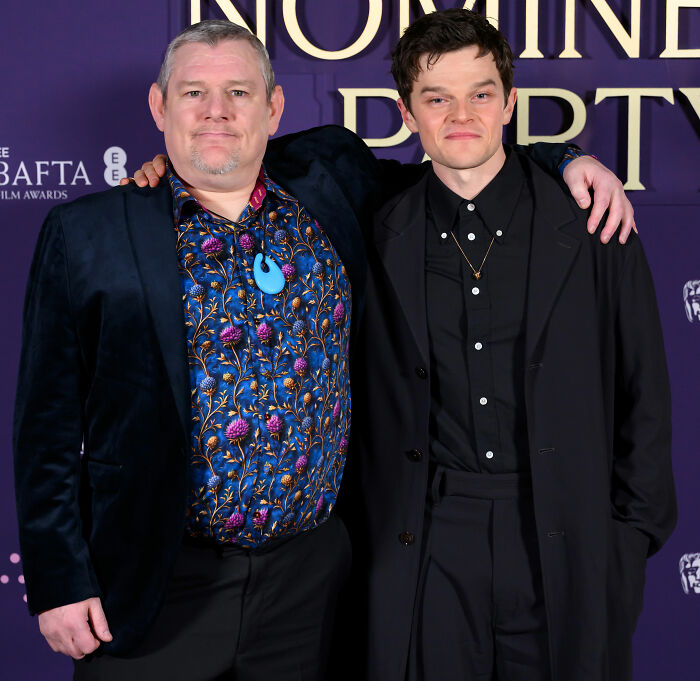 Two men posing together at the BAFTA event, unrelated to Michael B. Jordan's reaction after the audience incident.