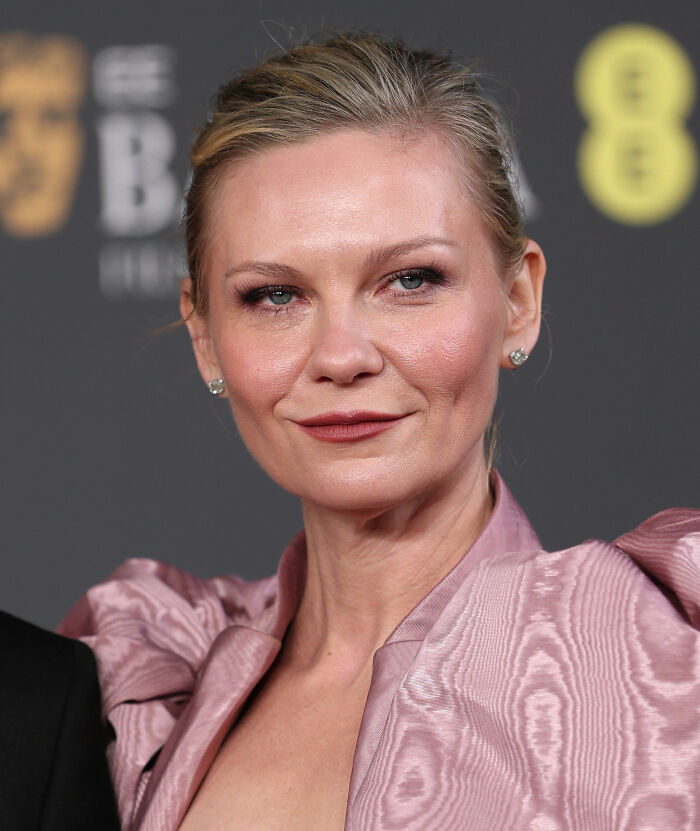Kirsten Dunst close-up portrait at the 2026 BAFTA's afterparty showing a fashion emergency and style blunder.