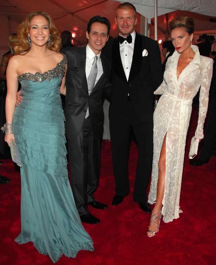 Marc Anthony and others posing on red carpet event, related to Brooklyn Beckham wedding accusations coverage.