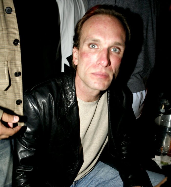 Peter Greene sitting in a leather jacket, looking serious, relating to discussions about his cause of passing.