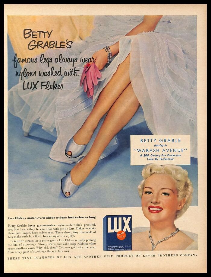 Vintage American ad featuring Lux Flakes with a woman showcasing nylon stockings and elegant style.