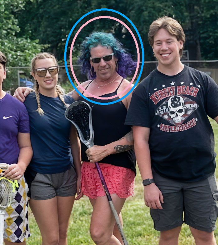 Transgender mom Roberta Esposito wearing sunglasses with purple hair holding a lacrosse stick outdoors with friends