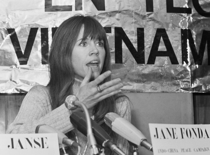 Black and white photo of a female celebrity speaking at a press conference about false crime accusations.
