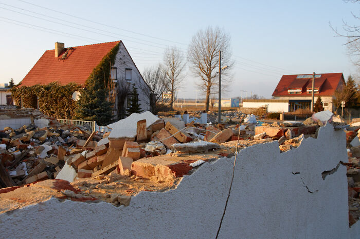 Ruins of a unique unusual place with damaged walls and houses under clear sky in a quiet rural area.