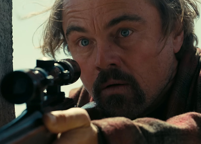Close-up of a man aiming a rifle through a scope, scene from Oscar nominated movies 2026 with intense focus.