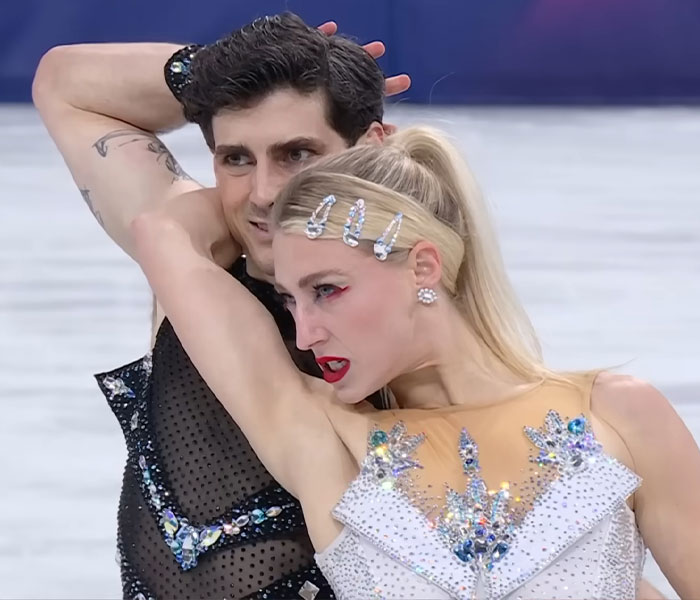 Figure skating pair performing an intense routine showcasing wildest bizarre moments of the 2026 Winter Olympics on ice.