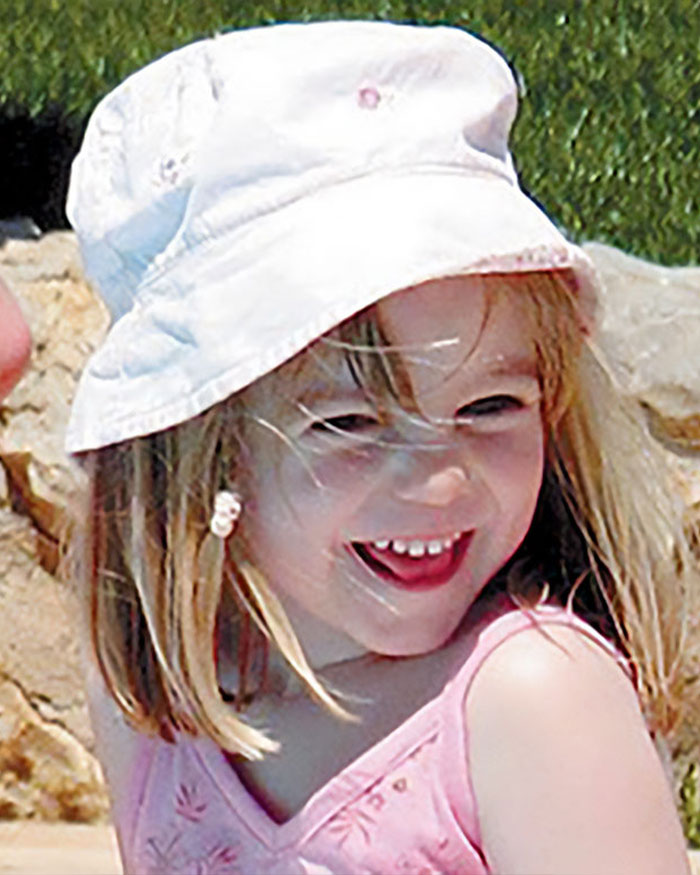 Smiling young girl wearing a white hat outdoors, related to Madeleine McCann abductor sketch debate. Smiling young girl wearing a white hat outdoors, related to Madeleine McCann abductor sketch debate.