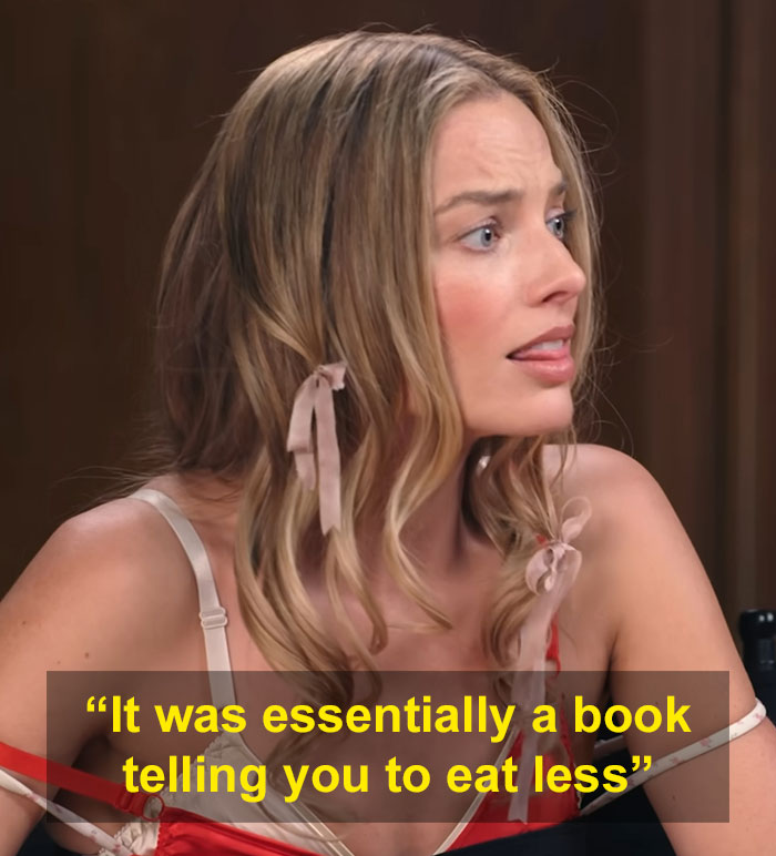 Margot Robbie reacting during an interview, discussing a controversial gift from a male actor that sparked women's collective fury.
