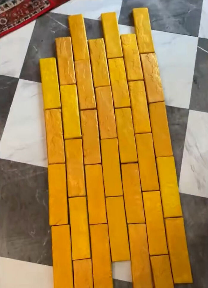 Yellow rectangular blocks arranged on a black and white tiled floor in a New York model's Titanic movie set. Yellow rectangular blocks arranged on a black and white tiled floor in a New York model's Titanic movie set.