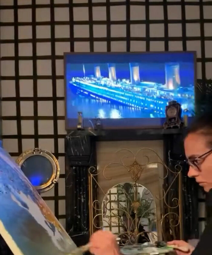 New York model painting Titanic scene in her NYC apartment designed like a Titanic movie set with vintage decor. New York model painting Titanic scene in her NYC apartment designed like a Titanic movie set with vintage decor.