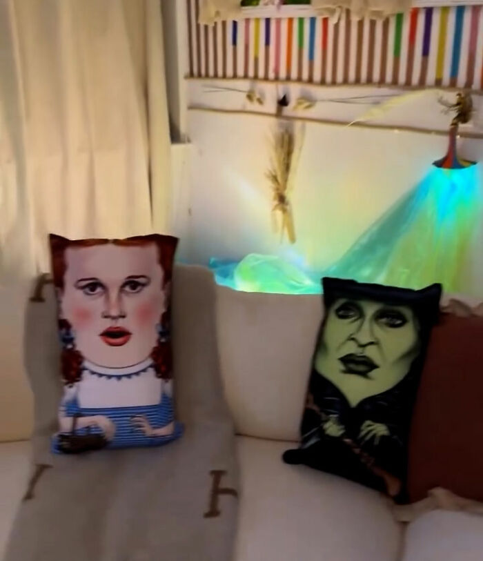 Two decorative pillows with painted faces on a couch in a New York apartment Titanic movie set. Two decorative pillows with painted faces on a couch in a New York apartment Titanic movie set.