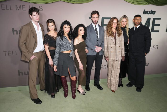 Cast of Tell Me Lies posing at a Hulu event, discussing the potential future of Tell Me Lies Season 4.
