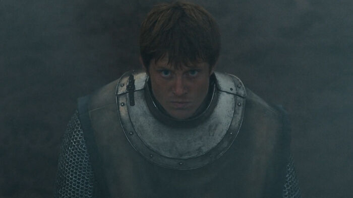 Ser Duncan in armor, emerging from smoke and fog, highlighting a pivotal moment in Knight of the Seven Kingdoms episode 4.