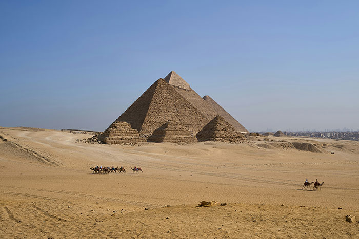 Pyramids at an archaeological job site with desert surroundings, illustrating real-life examples of traps and hazards.