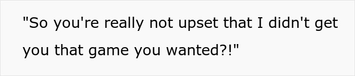 Woman upset as boyfriend likes her gift, showing unexpected reaction in a tense relationship moment.