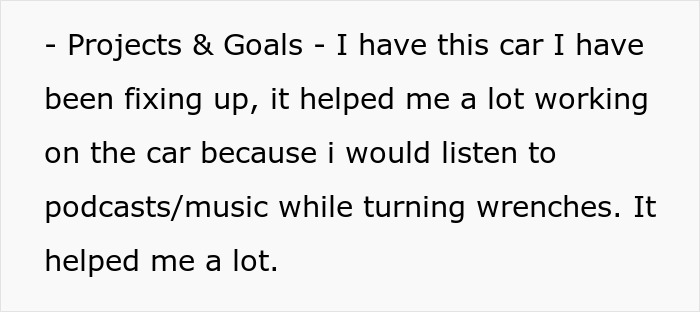 Man reflecting on projects and goals while working on car repairs, illustrating the man date single mom drama theme.