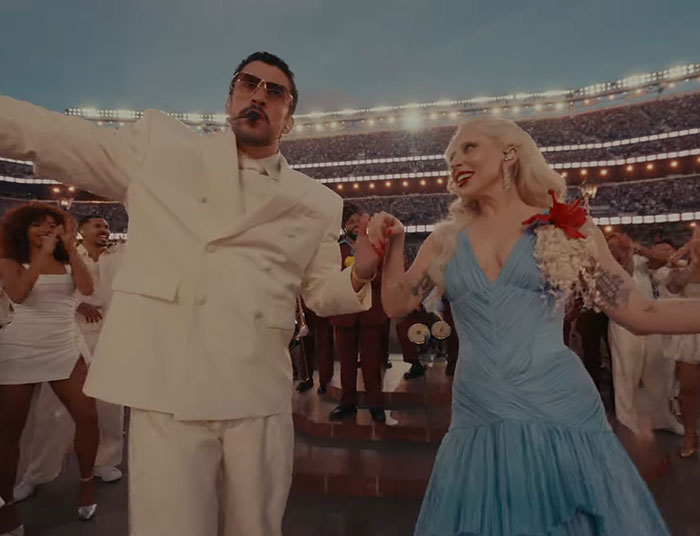 Bad Bunny performing at Super Bowl, fans reacting and debating translation of explicit lyrics in a lively stadium setting.