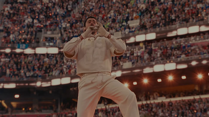 Bad Bunny performing at the Super Bowl halftime show, captivating viewers with his unique wedding-themed act.