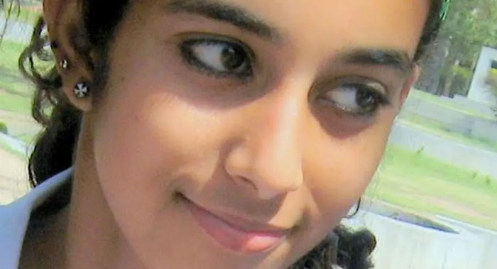 Close-up of a young woman looking sideways outdoors, evoking curiosity related to infamous unsolved mysteries.