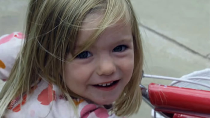 Young girl smiling outdoors, representing one of the infamous unsolved mysteries from around the world.