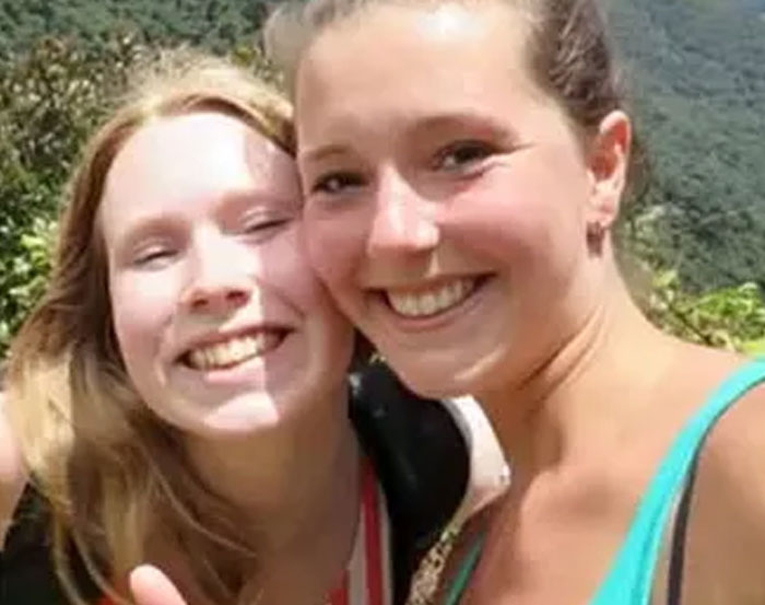 Two young women smiling outdoors with greenery and hills in the background, representing infamous unsolved mysteries.