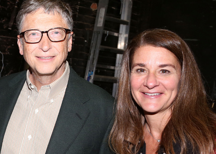 Bill Gates and Melinda smiling, pictured indoors, linked to Epstein files alleging STD and secret antibiotic use claims.