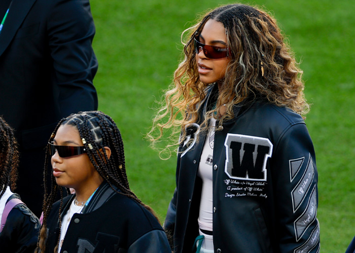 Blue Ivy and mom at the Super Bowl, showcasing striking genetics and close family resemblance in stylish outfits.