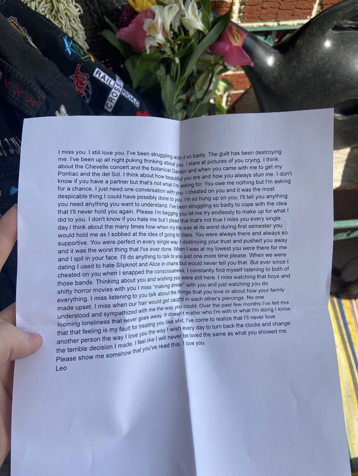 Hand holding a heartfelt letter from a cheater expressing regret and love, symbolizing heartbreak and emotional struggles.