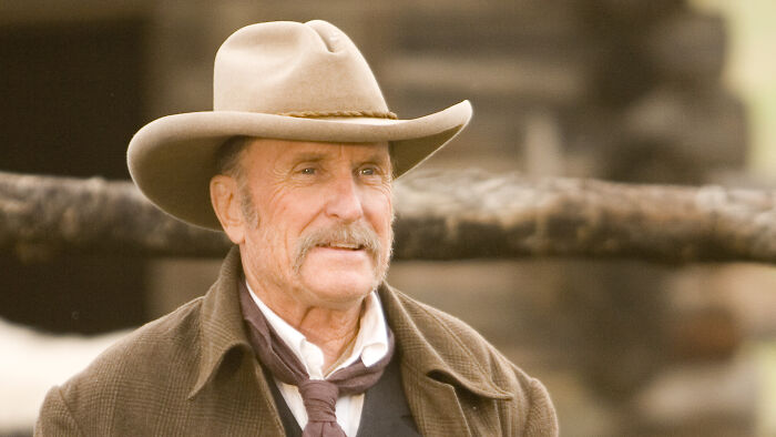 Robert Duvall in a western TV role wearing a cowboy hat and coat, showcasing his iconic streaming era presence. Robert Duvall in a western TV role wearing a cowboy hat and coat, showcasing his iconic streaming era presence.