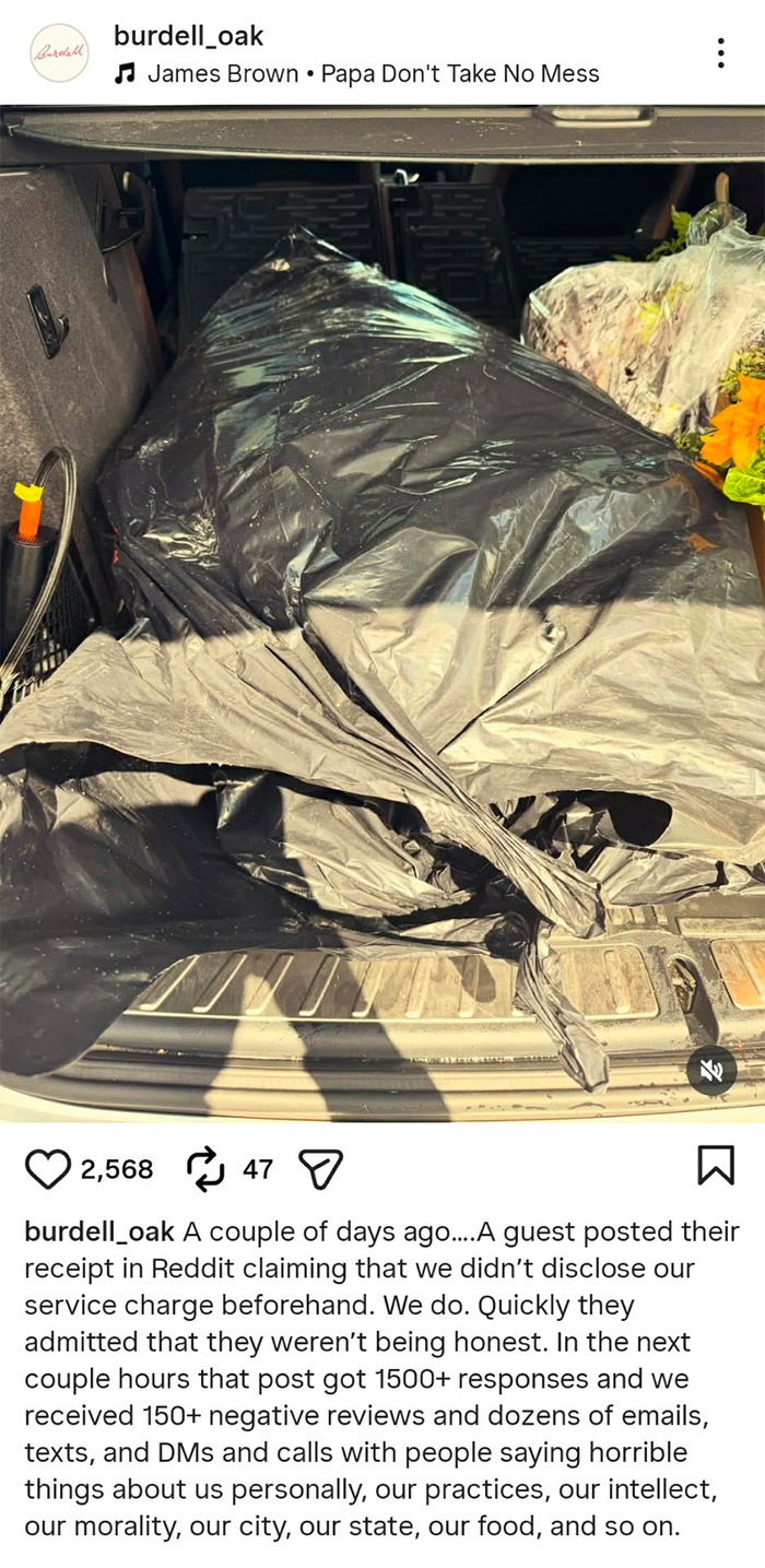 Black plastic bag in car trunk, related to outrage after top restaurant adds automatic 20% tip over country's past.