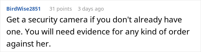 Man stressed and paranoid looking worriedly outside his home, uneasy about unhinged neighbor interaction.