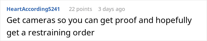 Man looking stressed and paranoid, sitting indoors with a distressed expression due to unhinged neighbor issues.