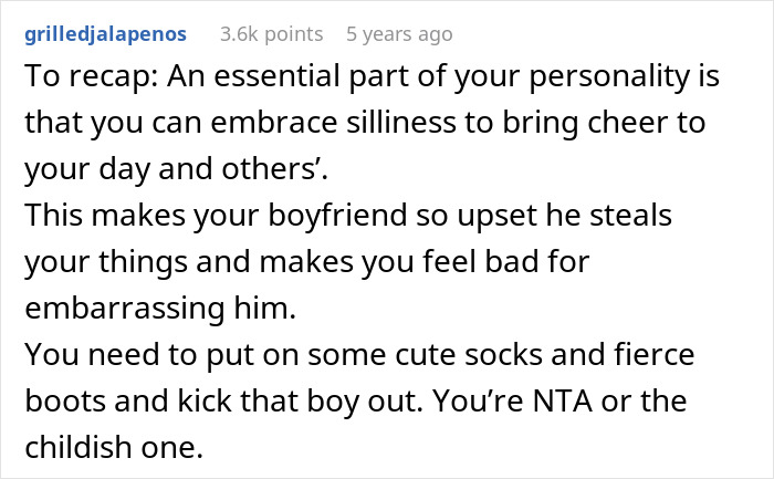 Woman enjoying fun sock collection after boyfriend trashes her belongings, embracing silliness and self-confidence.