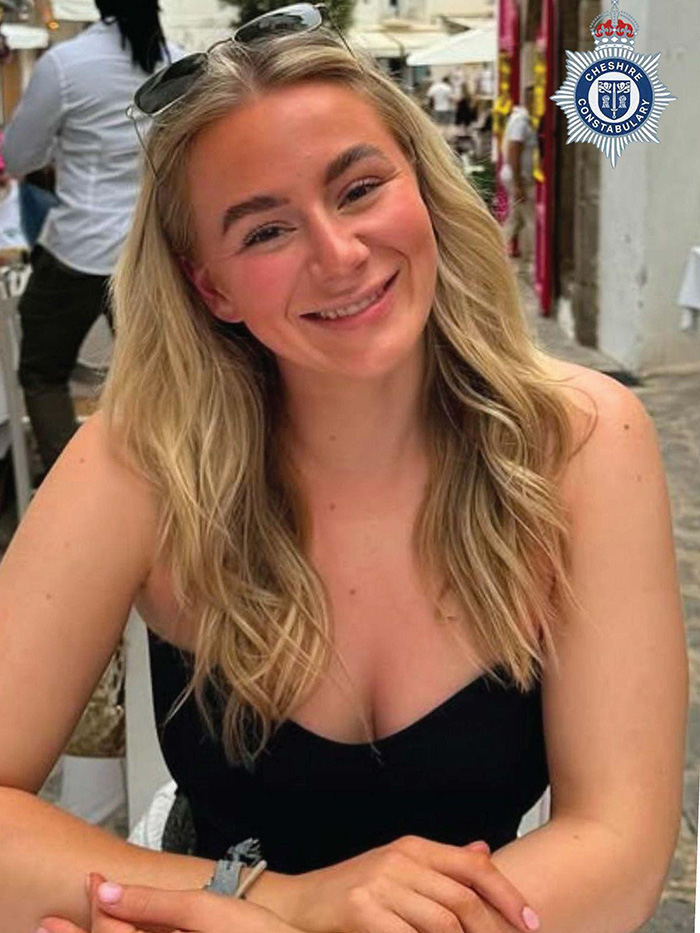 Young woman with long blonde hair smiling at the camera in an outdoor setting, related to legal expert and charges topic.